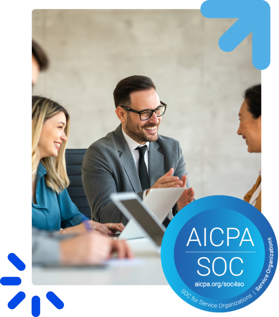 Smiling coworkers participating in a casual team meeting with a laptop open on the table